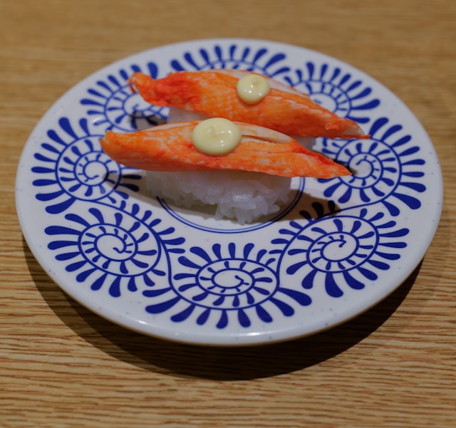 Colorful assorted sushi plates on a conveyor belt in Tokyo