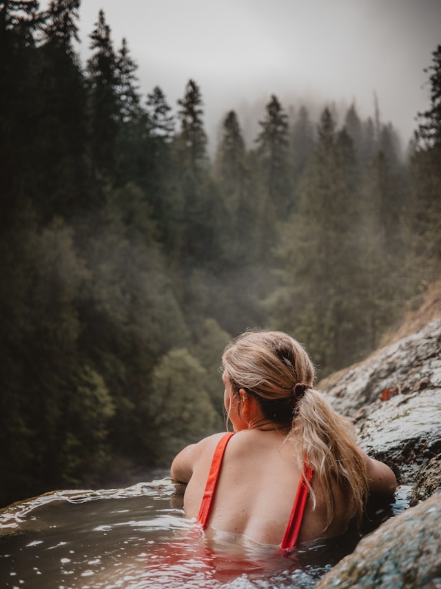 Traditional Japanese outdoor onsen with mountain view