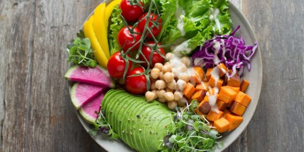 Fresh vegan salad bowl on a wooden table at a restaurant in Minato Tokyo