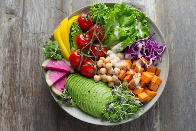 Fresh vegan salad bowl on a wooden table at a restaurant in Minato Tokyo