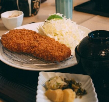 Crispy golden tonkatsu cutlet with rice and miso soup in Tokyo restaurant